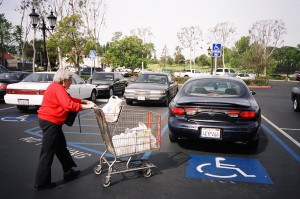 90 year old Mum pushing shoping cart to hercar