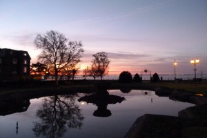 Sunrise reflected in pond at Prittlewell Gardens