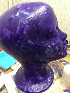 Purple polystyrene head ready to be attached to stand
