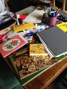 books and papers piled on the table