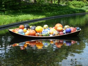 A boat full of giant Chihuly glass balls