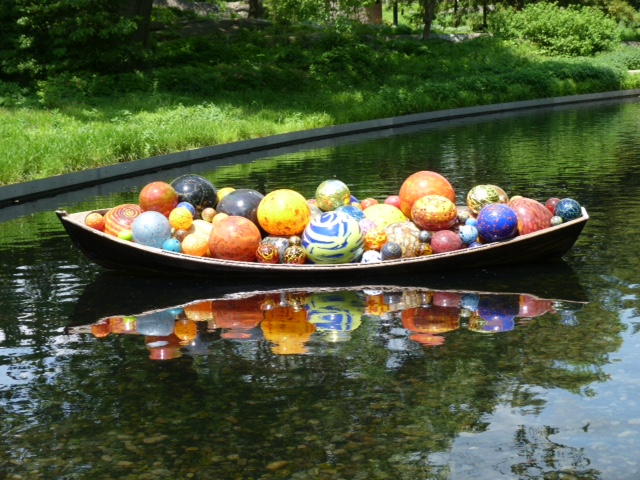 A boat full of giant Chihuly glass balls 