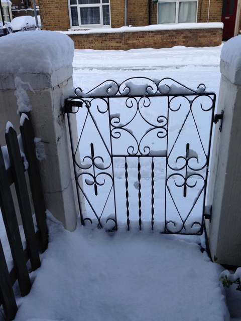 snow on the metal gate