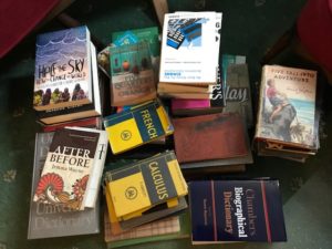 pile of books on floor